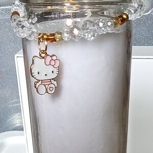 Handmade beaded glass bracelet with charms  Size 7.  Color White